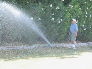 Jerry surveys a newly installed Rain Bird's throw distance